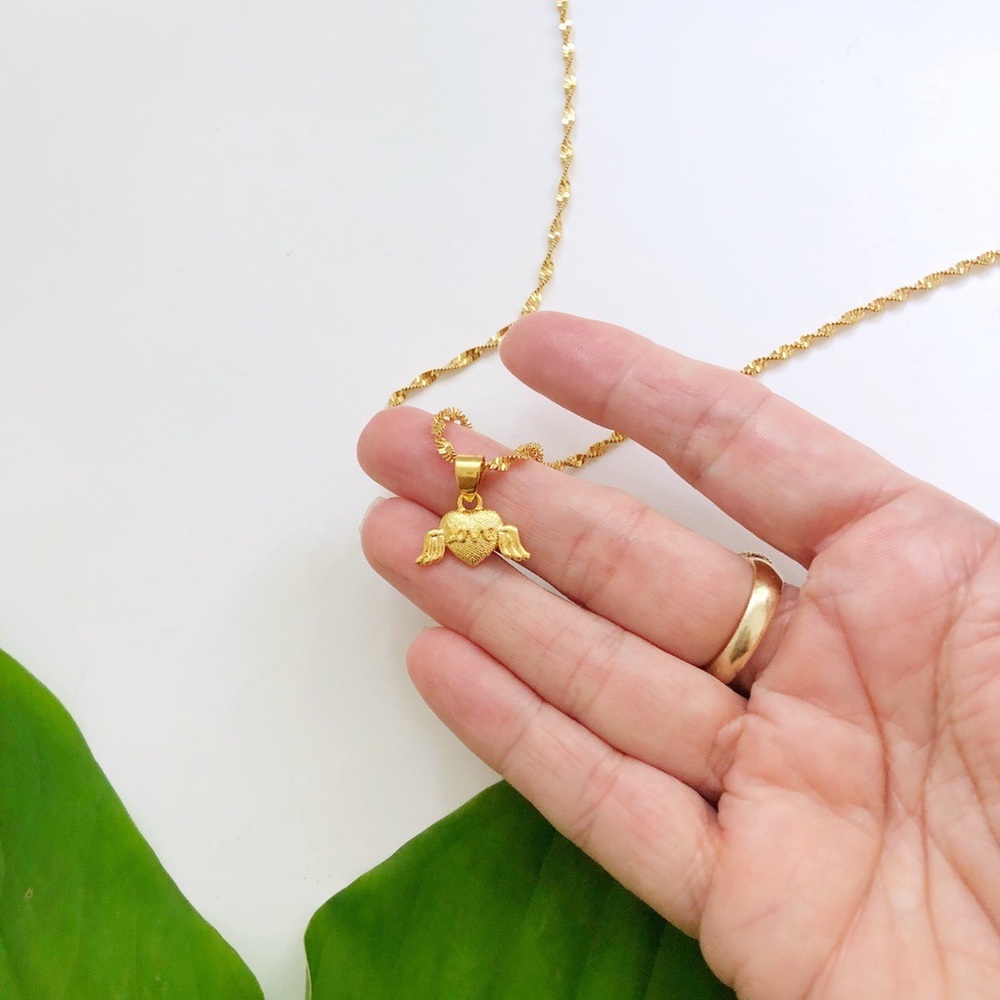 Gold chain necklace with winged heart pendant